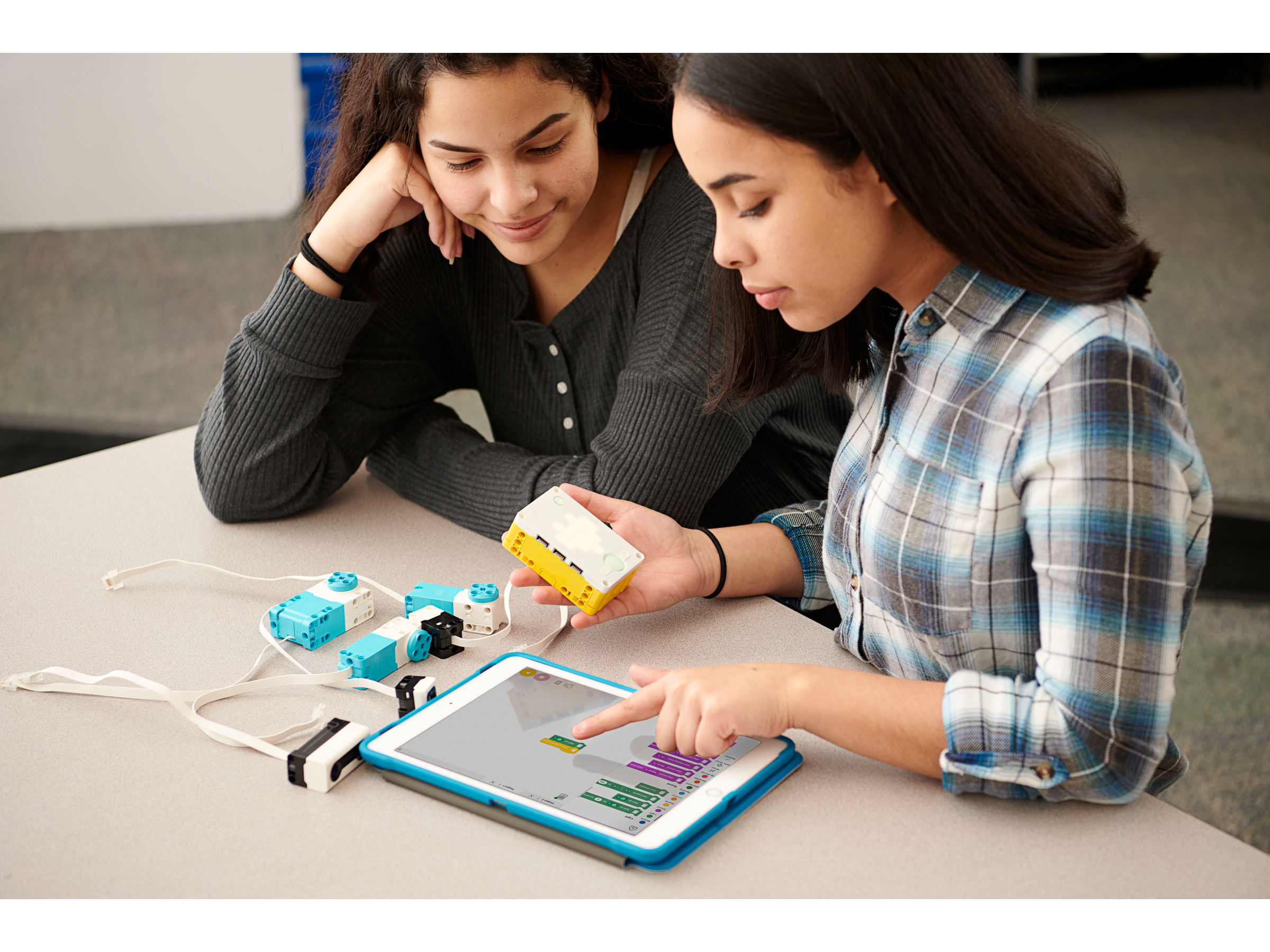 Two secondary students coding their LEGO Education SPIKE Prime set with the SPIKE Prime app.